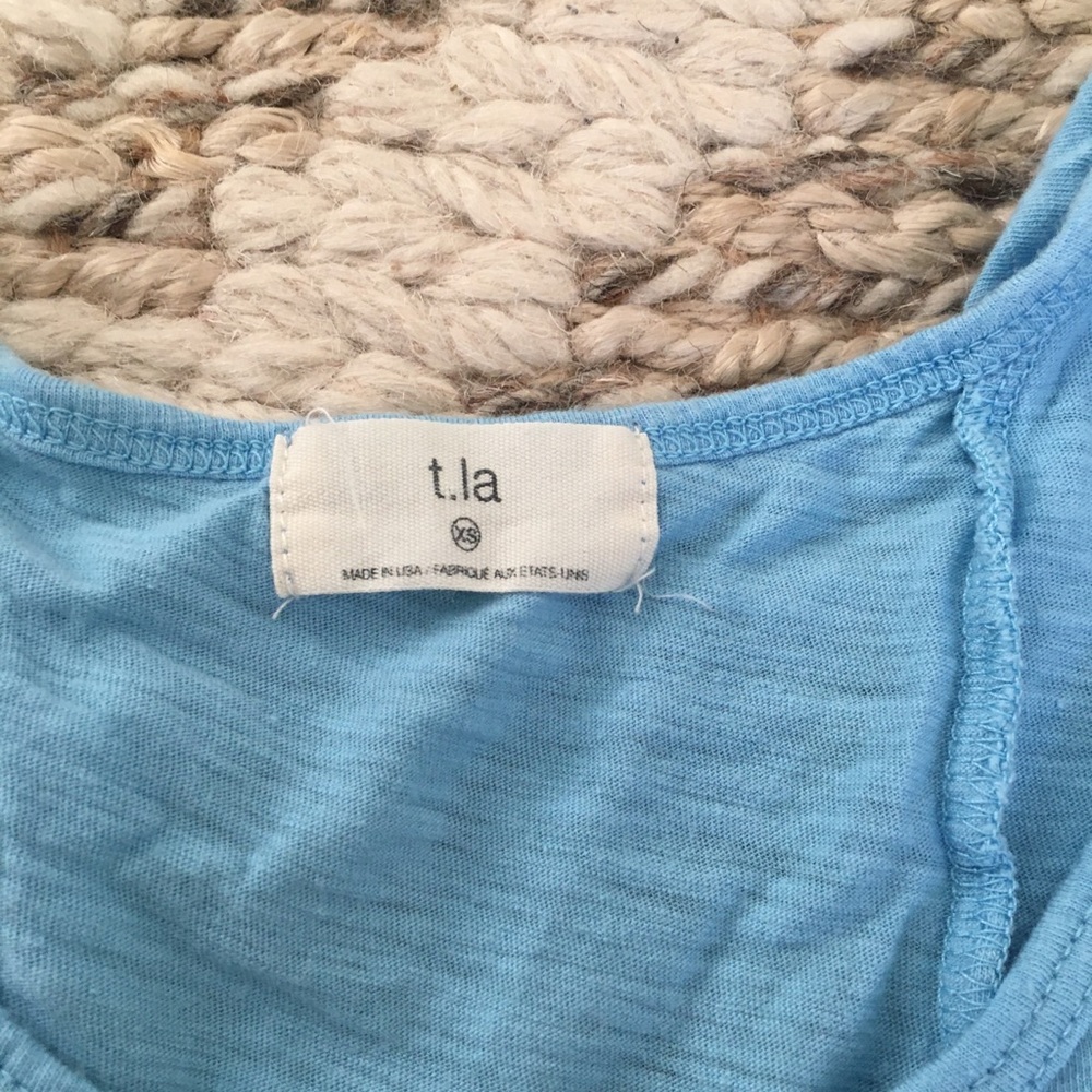 t.la sleeveless ruffle tee
